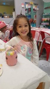 girl with unicorn mug pottery painting